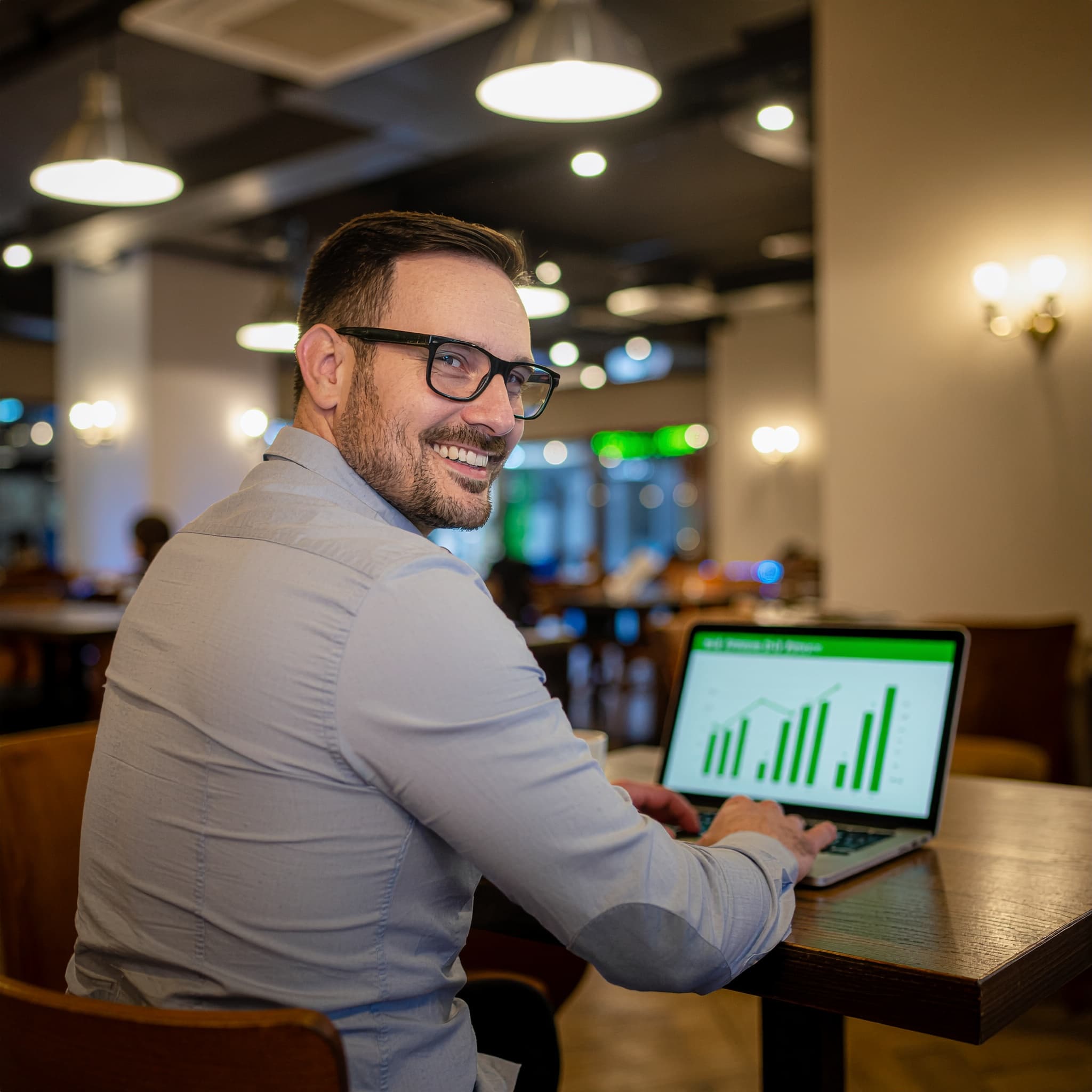 Restaurant owner reviewing profit data